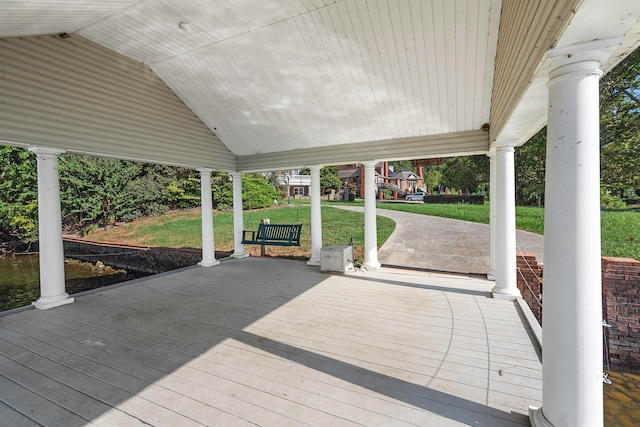 wooden deck featuring a yard