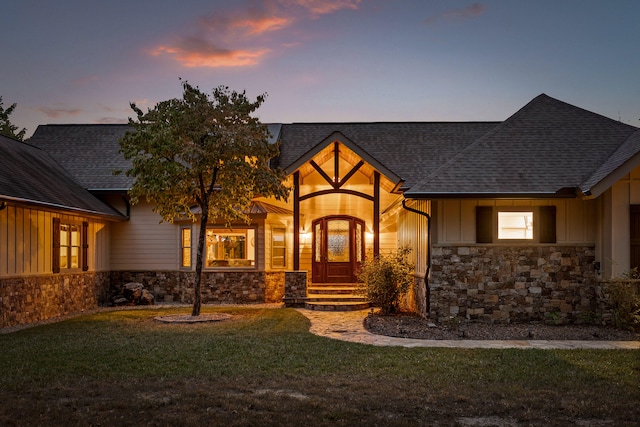 view of front of property with a lawn