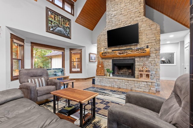 living room featuring wooden ceiling, hardwood / wood-style flooring, a fireplace, and high vaulted ceiling