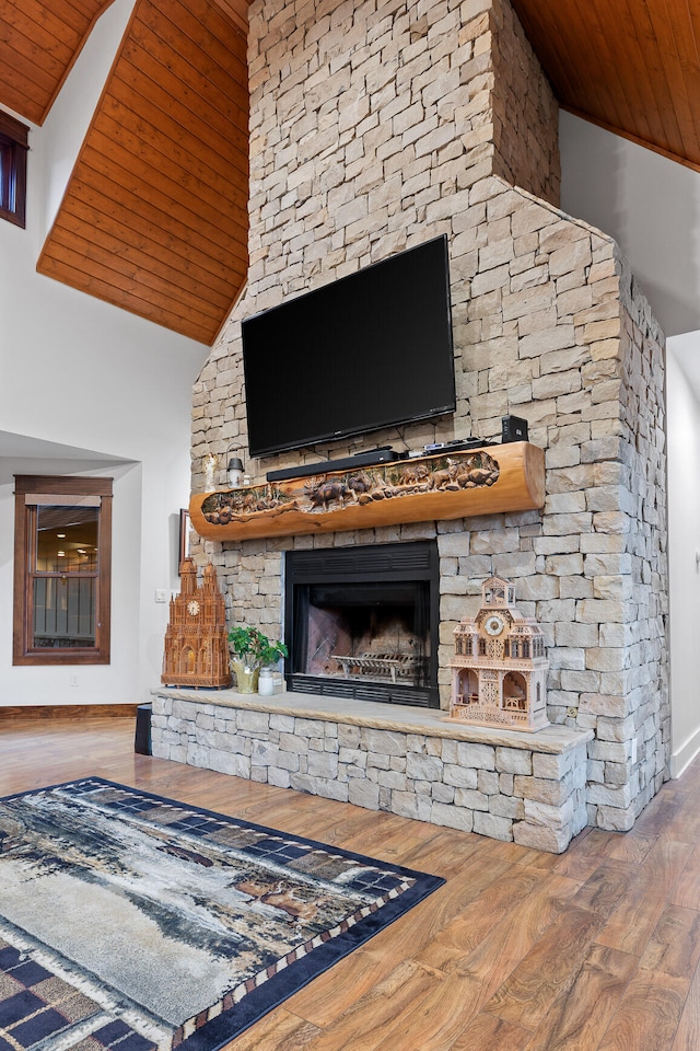 living room with wooden ceiling, a fireplace, high vaulted ceiling, and hardwood / wood-style flooring