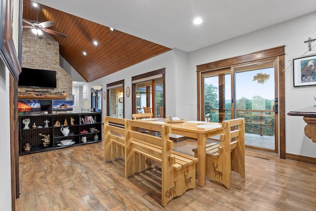 dining area featuring hardwood / wood-style floors, wood ceiling, lofted ceiling, and ceiling fan