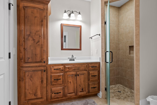 bathroom featuring vanity, tile patterned flooring, and an enclosed shower