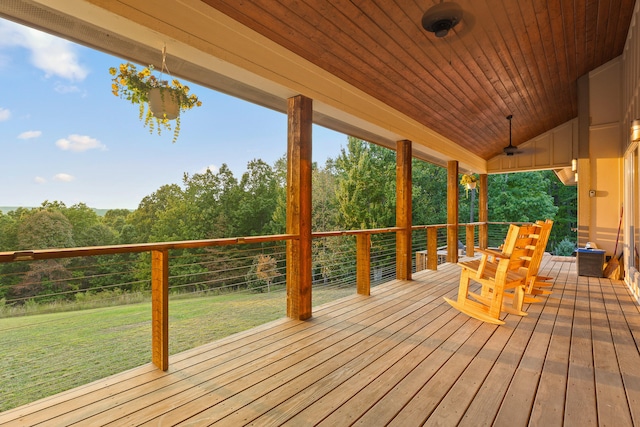 wooden deck featuring a yard