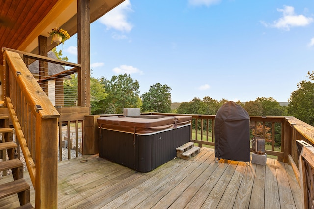 wooden terrace with a hot tub