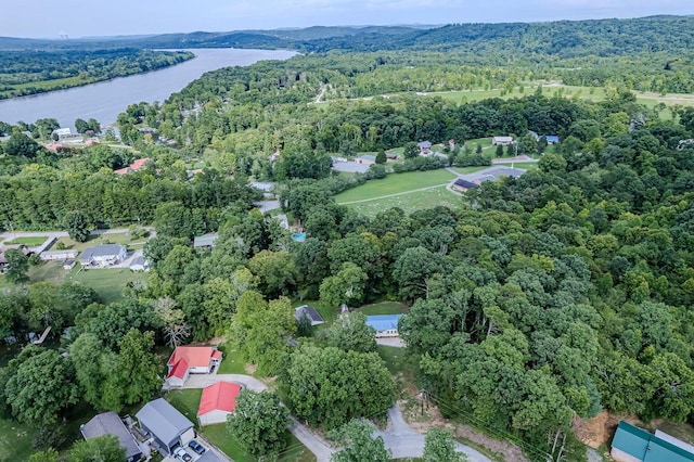 aerial view featuring a water view and a wooded view