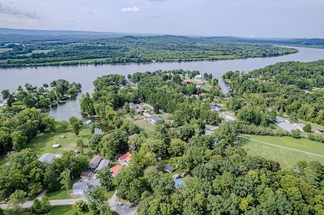 aerial view with a wooded view and a water view