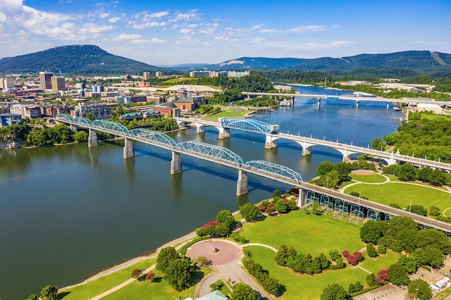 aerial view featuring a water and mountain view