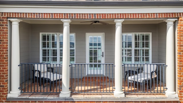 property entrance featuring covered porch and ceiling fan