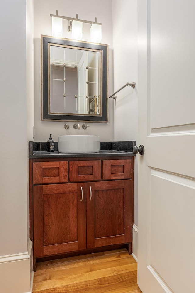 bathroom featuring vanity and hardwood / wood-style floors