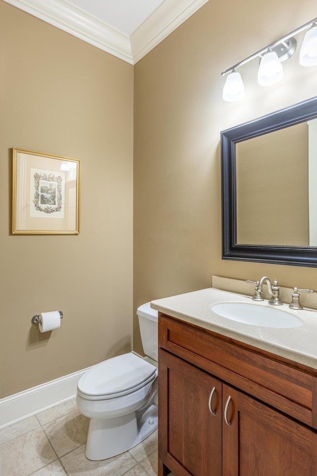 bathroom with ornamental molding, tile patterned flooring, vanity, and toilet