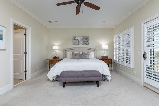 carpeted bedroom with ceiling fan and crown molding