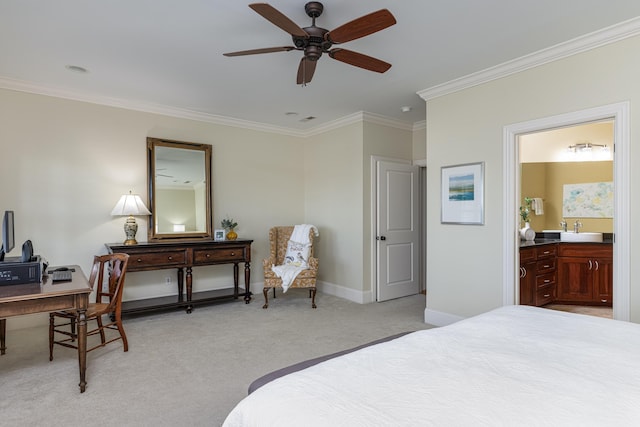 carpeted bedroom featuring sink, ensuite bathroom, ceiling fan, and ornamental molding