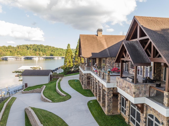 surrounding community featuring a water view