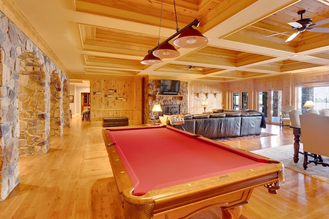 game room featuring a stone fireplace, beamed ceiling, coffered ceiling, pool table, and ceiling fan