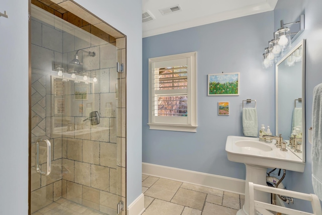 bathroom featuring crown molding and a shower with shower door