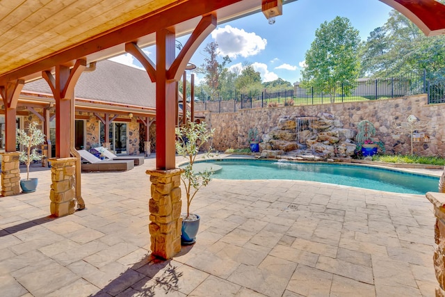 view of swimming pool with a patio