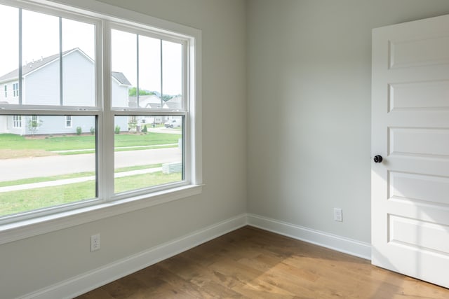 spare room with light hardwood / wood-style floors