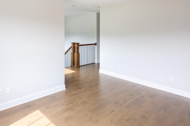 unfurnished room featuring hardwood / wood-style flooring