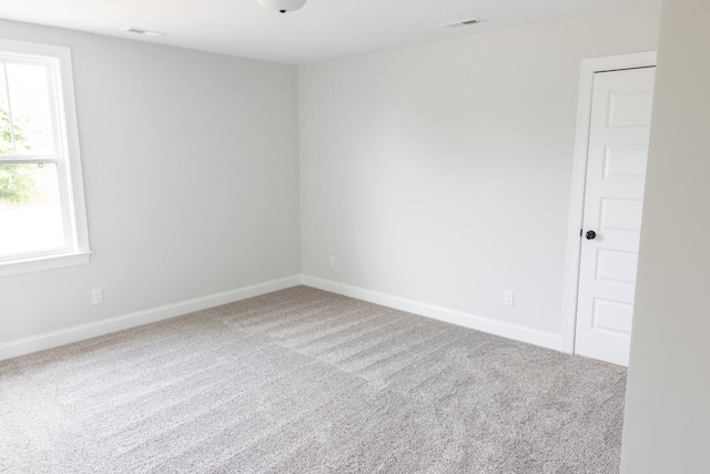 unfurnished room with carpet flooring