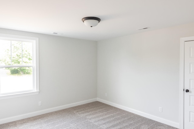 unfurnished room with carpet flooring