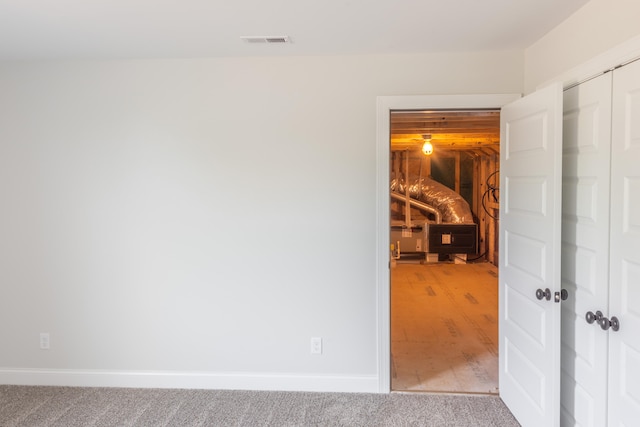 spare room with hardwood / wood-style flooring