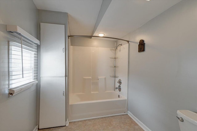 bathroom with toilet and washtub / shower combination