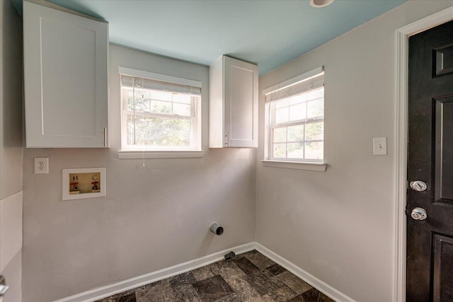 laundry room featuring washer hookup, cabinets, and plenty of natural light