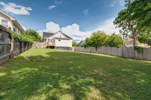 view of yard featuring a wooden deck