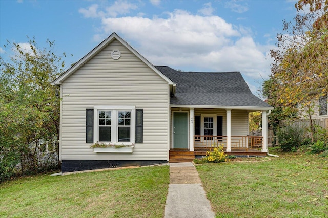 bungalow with a porch and a front yard