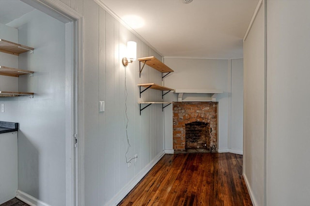 hall featuring dark hardwood / wood-style flooring and ornamental molding