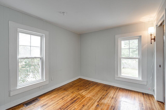 unfurnished room featuring light wood-type flooring