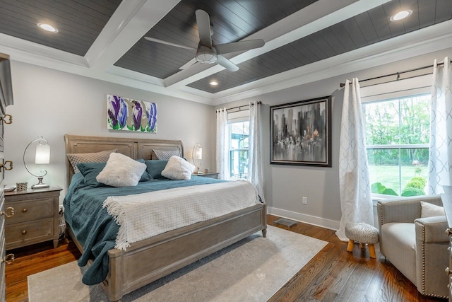 bedroom with ceiling fan, dark hardwood / wood-style floors, ornamental molding, and multiple windows