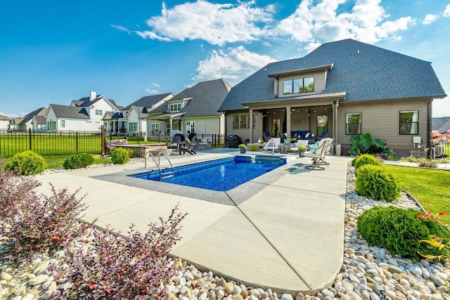 view of swimming pool with a lawn and a patio area