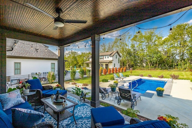 view of patio / terrace featuring ceiling fan and a fenced in pool