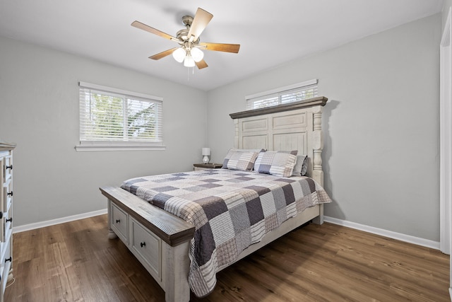 bedroom with ceiling fan and dark wood-type flooring