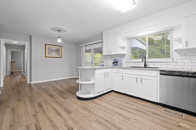 kitchen with white cabinetry, tasteful backsplash, dishwasher, decorative light fixtures, and sink