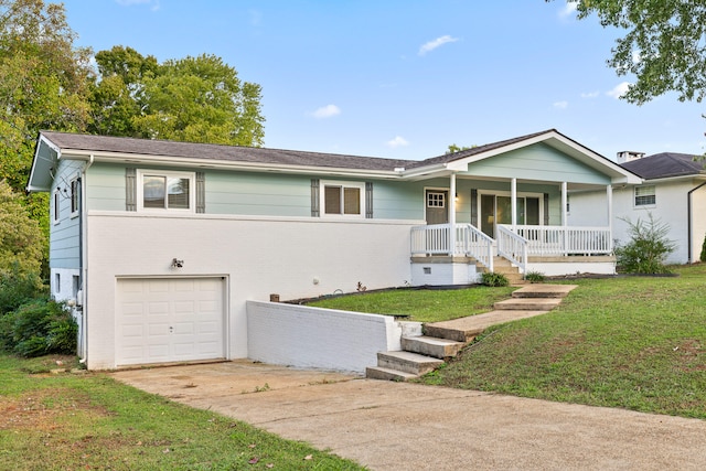 ranch-style home with a front yard, a garage, and a porch