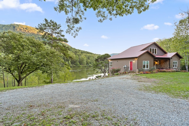 view of front of house featuring a water and mountain view