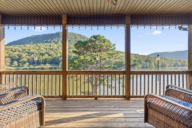 wooden terrace featuring a mountain view