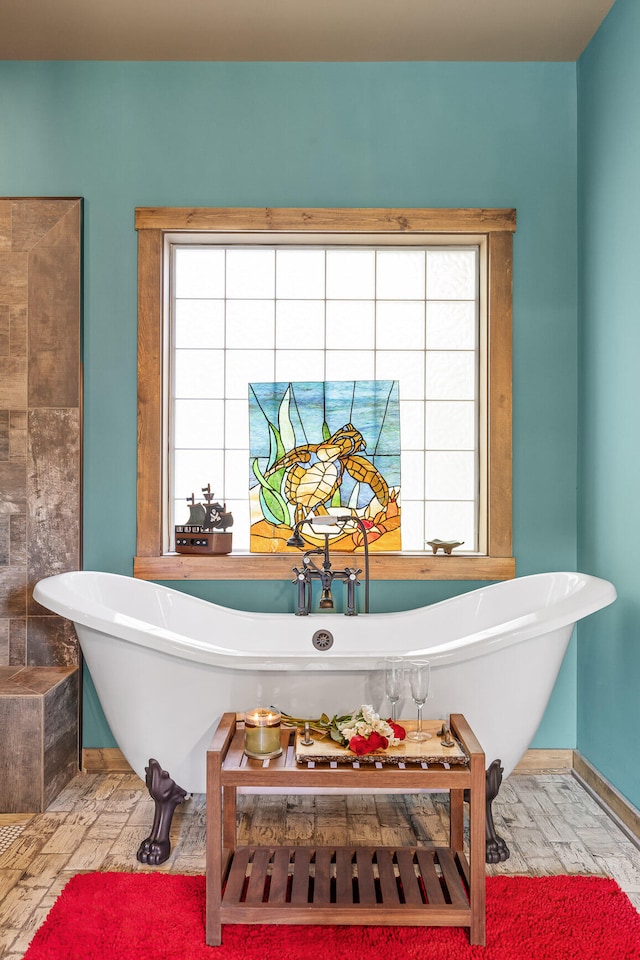 interior space featuring hardwood / wood-style flooring and a washtub