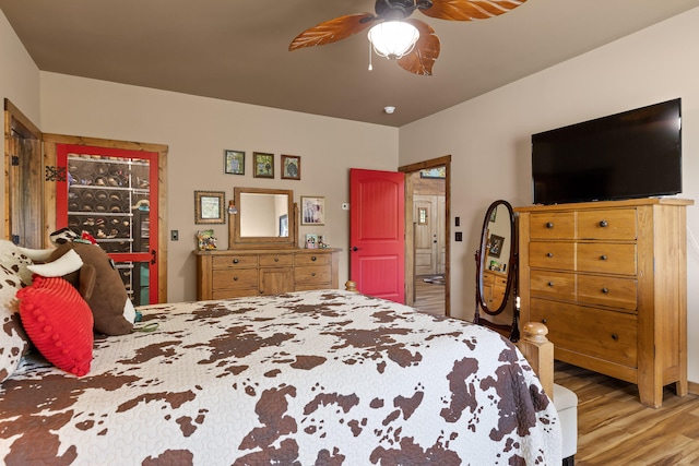 bedroom featuring light hardwood / wood-style floors and ceiling fan