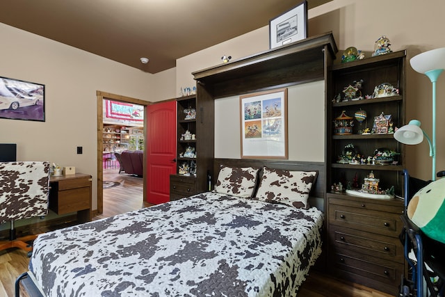 bedroom featuring dark hardwood / wood-style flooring