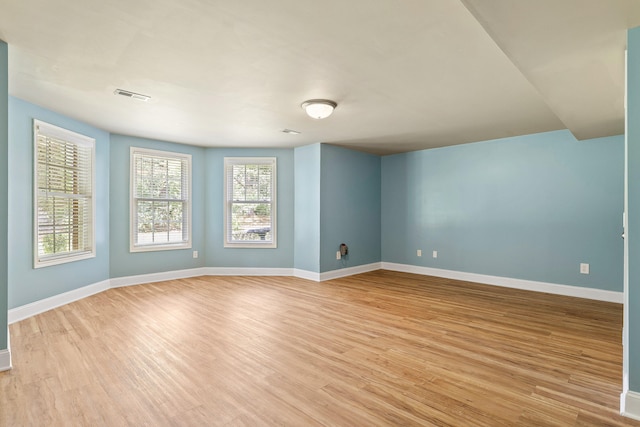 spare room with light wood-type flooring