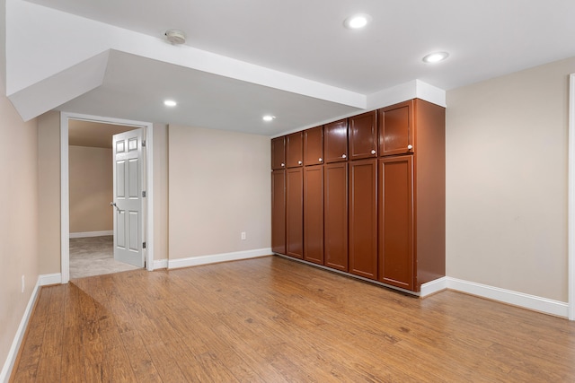 unfurnished room with light wood-type flooring