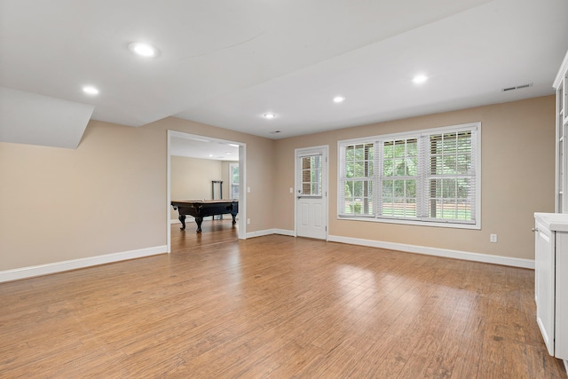 unfurnished living room with billiards and light hardwood / wood-style floors