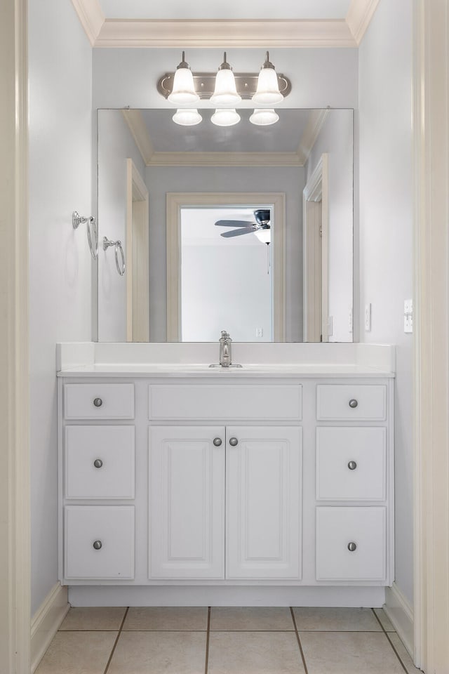 bathroom with vanity, ornamental molding, and tile patterned floors