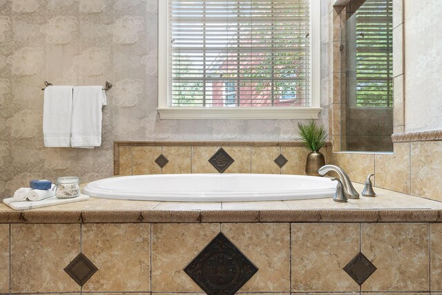 bathroom with tiled tub