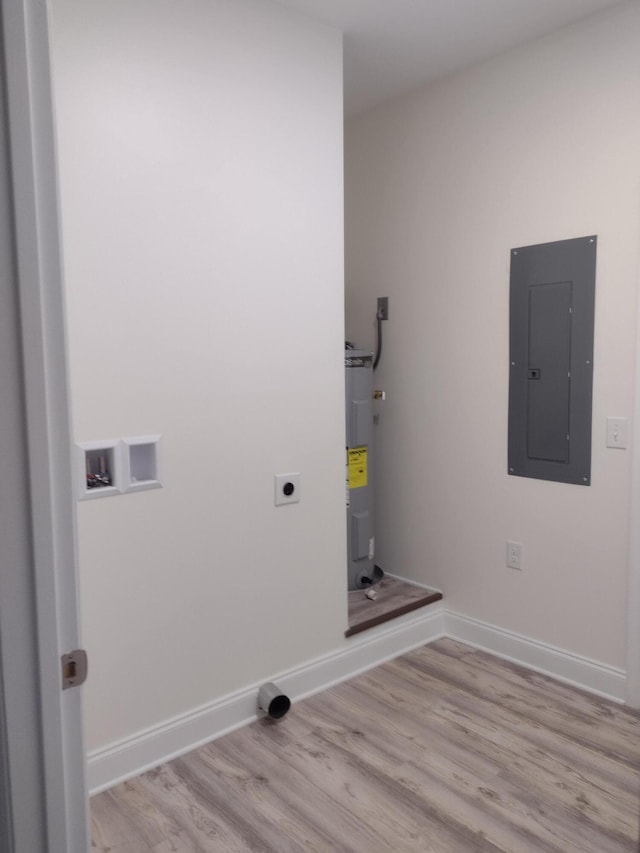 clothes washing area with electric water heater, light wood-type flooring, hookup for an electric dryer, and electric panel