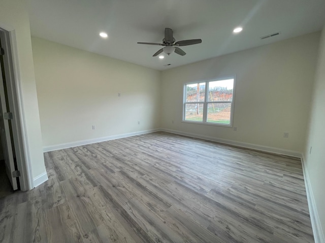 unfurnished room with light hardwood / wood-style floors and ceiling fan