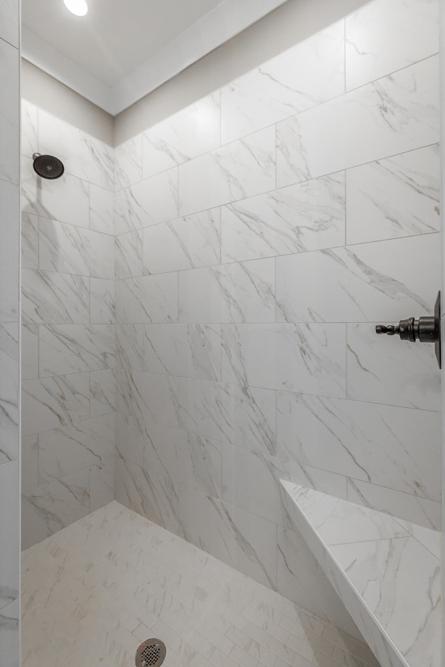 bathroom featuring tiled shower